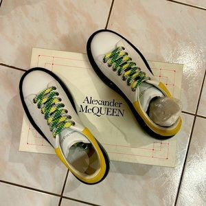 Alexander McQueen Larry Sneakers. Champagne white with green and yellow accents.
